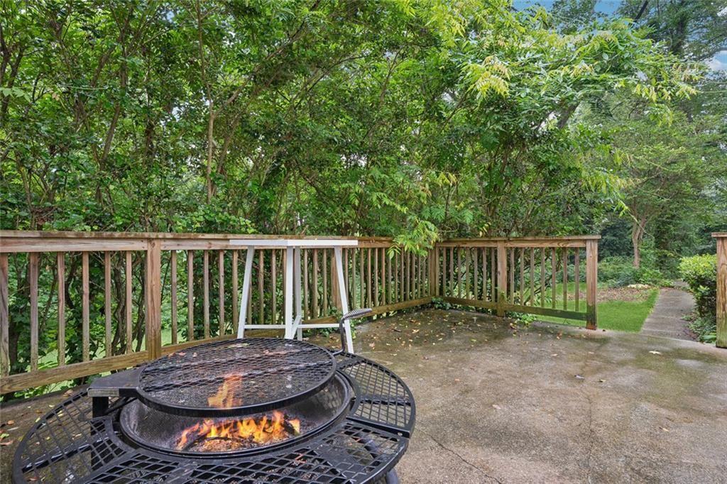 4136 Weelaunee Road Ellenwood, GA 30294 - Photo 21 of 22 a view of a backyard with plants and tree