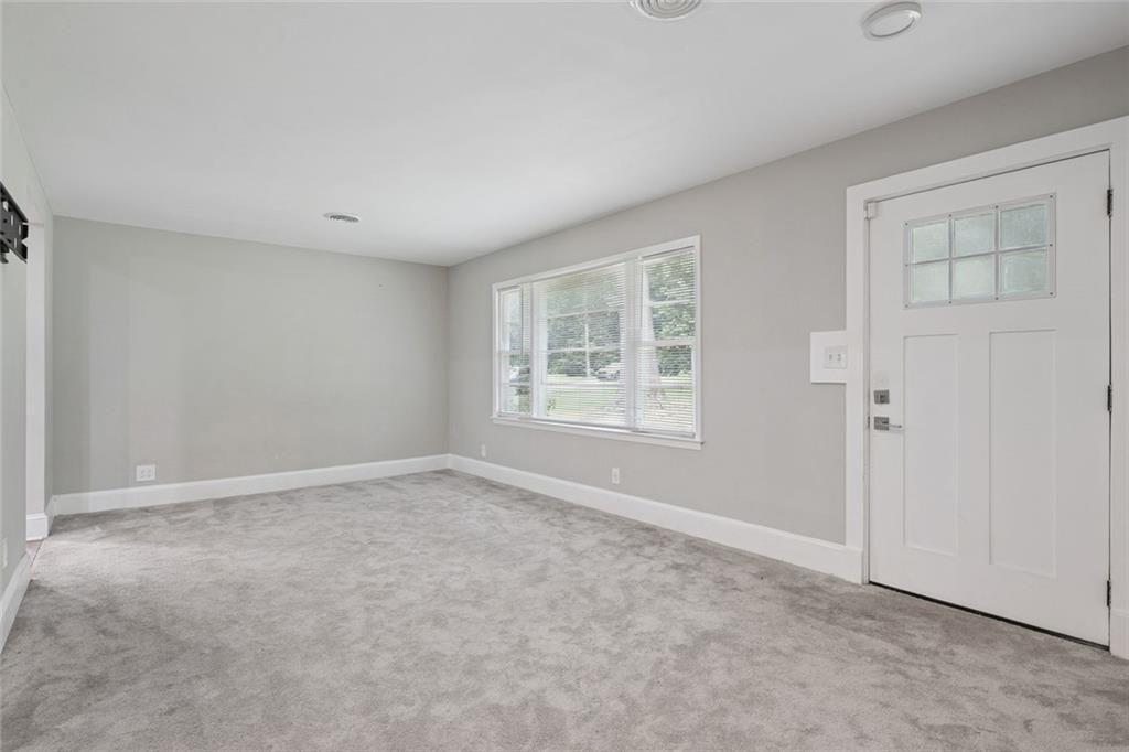 4136 Weelaunee Road Ellenwood, GA 30294 - Photo 3 of 22 an empty room with windows