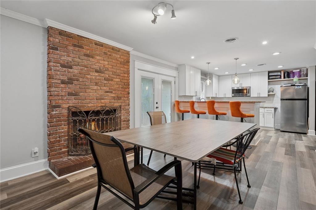 4136 Weelaunee Road Ellenwood, GA 30294 - Photo 6 of 22 a dining room with furniture and a table