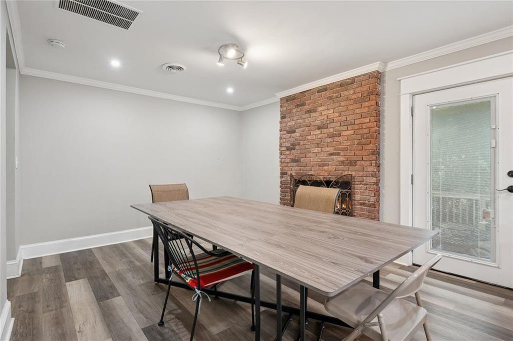 4136 Weelaunee Road Ellenwood, GA 30294 - Photo 7 of 22 a dining room with a table and chairs