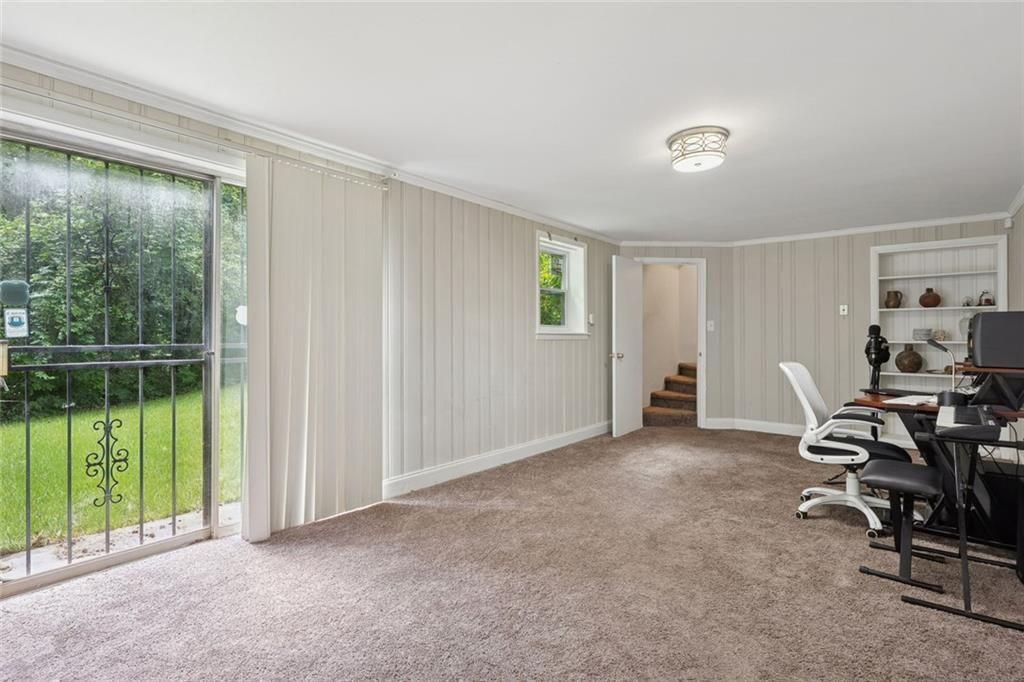 4136 Weelaunee Road Ellenwood, GA 30294 - Photo 10 of 22 a view of a room with workspace and a window