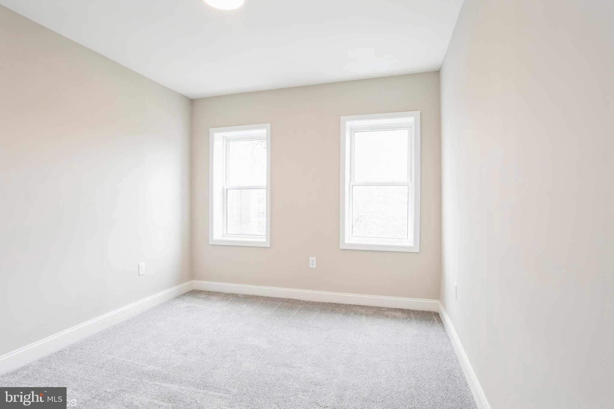 3025 Walbrook Avenue Baltimore, MD 21216 - Photo 14 of 16 an empty room with a window