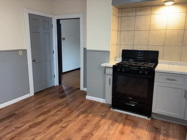 a kitchen with a stove and a refrigerator