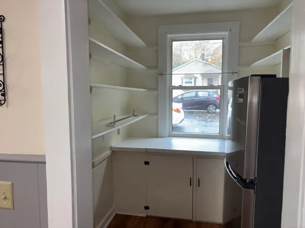 a view of cabinets and wooden floor