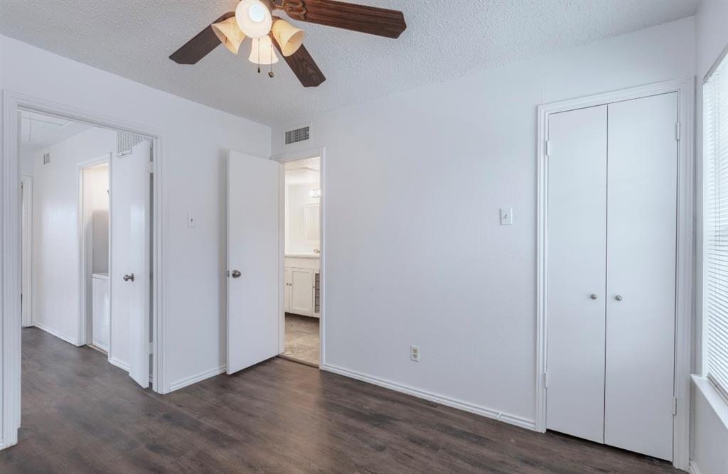 15151 Berry Trail, Unit 201 Dallas, TX 75248 - Photo 11 of 12 a view of a room with wooden floor