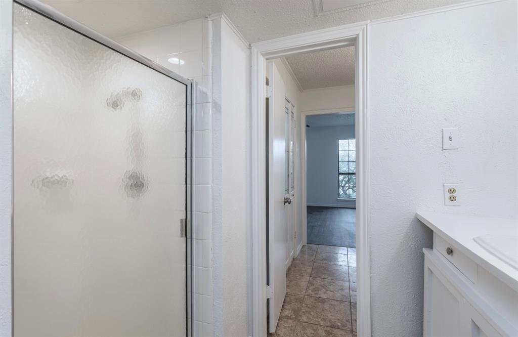 15151 Berry Trail, Unit 201 Dallas, TX 75248 - Photo 9 of 12 a view of a bathroom with a bathroom