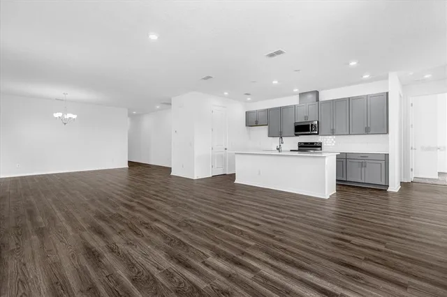 a view of kitchen with wooden floor