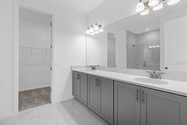a bathroom with a double vanity sink and a mirror