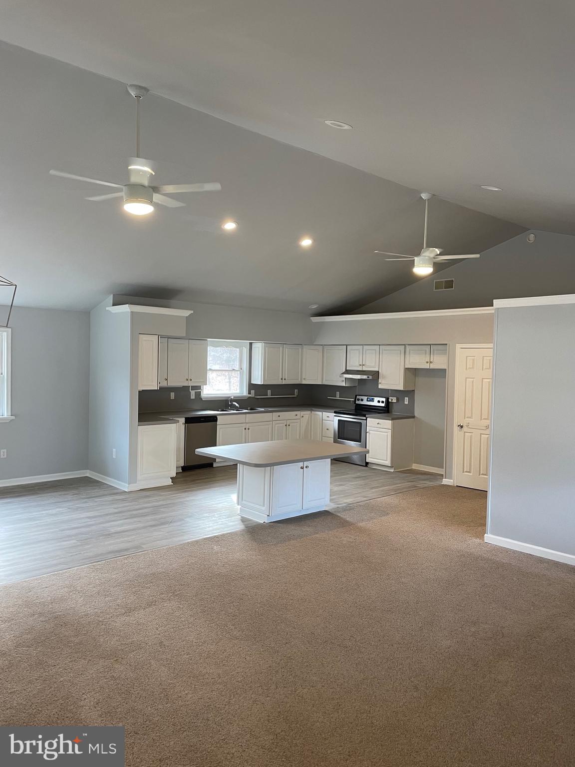 3266 Rosstown Road Wellsville, PA 17365 - Photo 11 of 31 a view of kitchen and kitchen with a sink cabinets and window