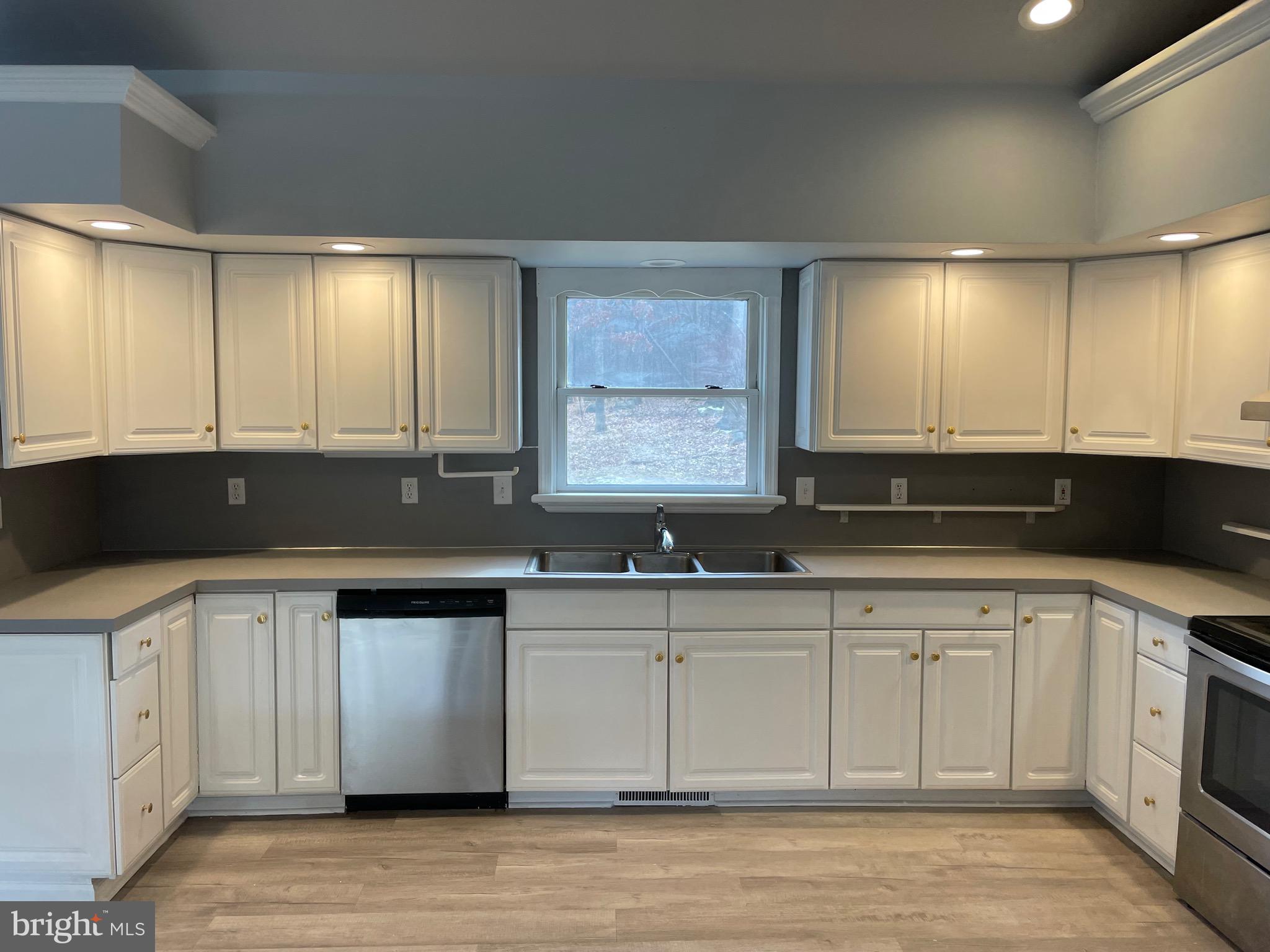 3266 Rosstown Road Wellsville, PA 17365 - Photo 13 of 31 a kitchen with a sink and cabinets