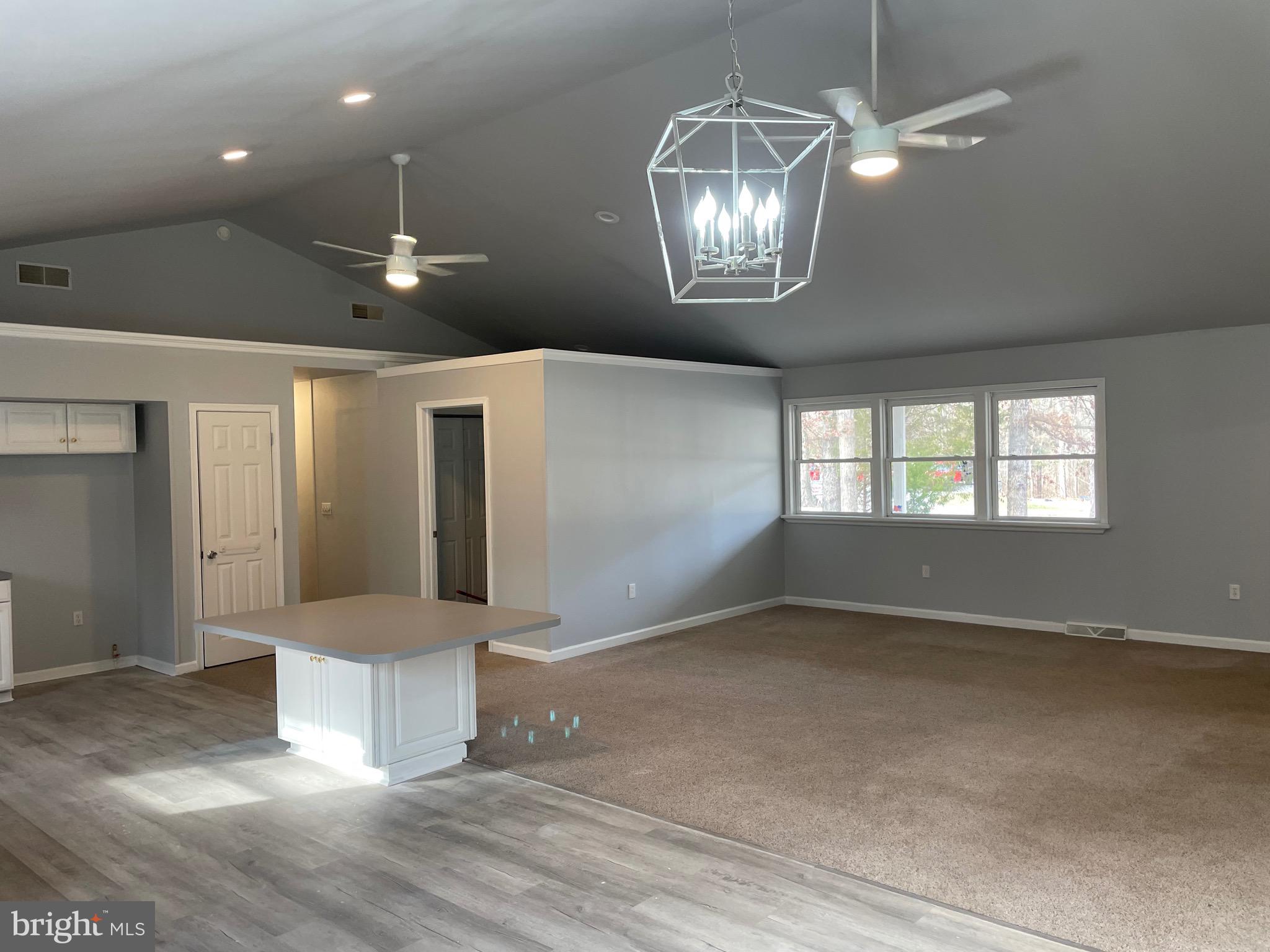 3266 Rosstown Road Wellsville, PA 17365 - Photo 16 of 31 an empty room with wooden floor and mirror