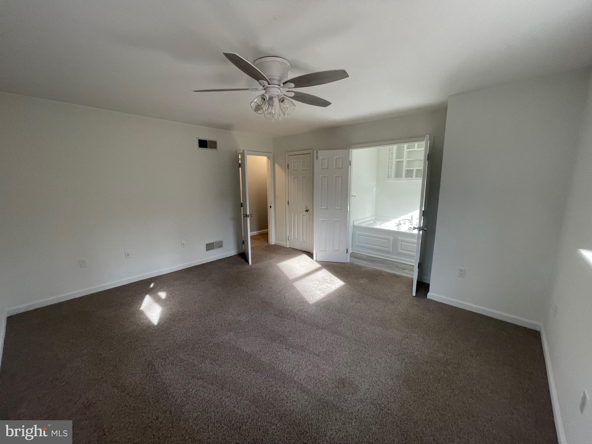 3266 Rosstown Road Wellsville, PA 17365 - Photo 20 of 31 a view of empty room with wooden floor and fan