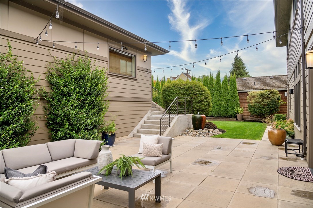 212 5th Avenue West Kirkland, WA 98033 - Photo 2 of 36 a view of a patio with couches table and chairs and potted plants