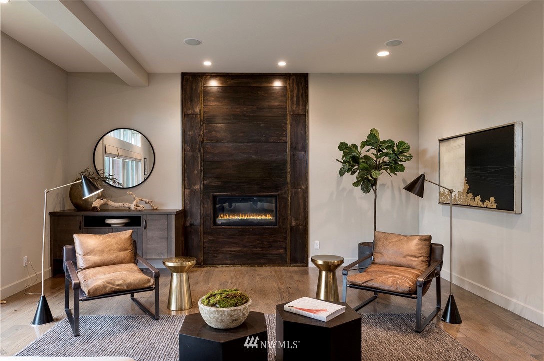 212 5th Avenue West Kirkland, WA 98033 - Photo 11 of 36 a living room with furniture a flat screen tv and a potted plant