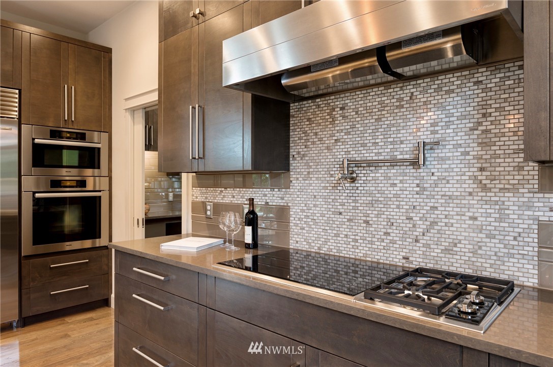 212 5th Avenue West Kirkland, WA 98033 - Photo 15 of 36 a kitchen with a stove and a microwave