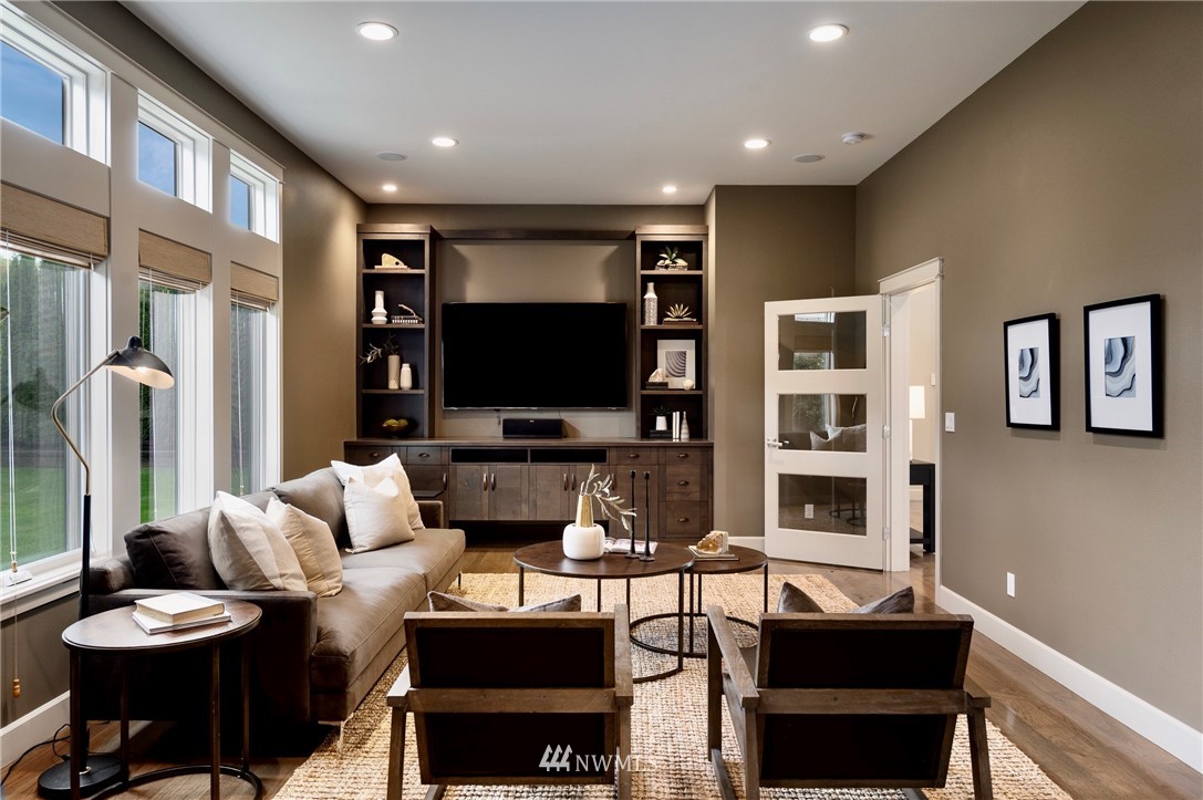 212 5th Avenue West Kirkland, WA 98033 - Photo 20 of 36 a living room with furniture and a flat screen tv