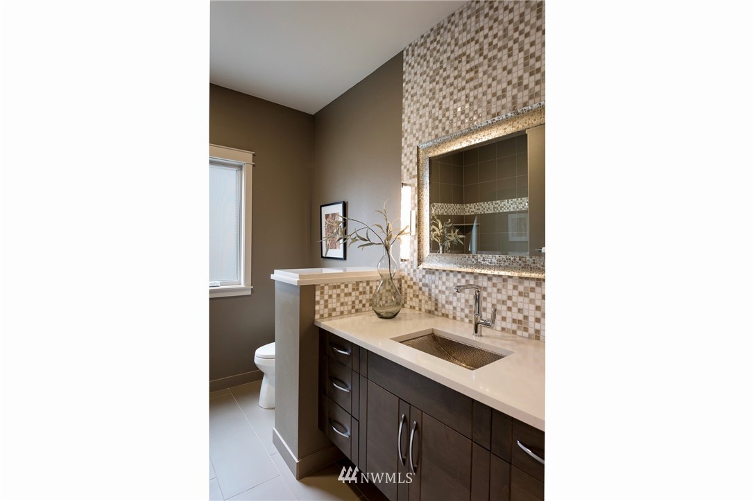 212 5th Avenue West Kirkland, WA 98033 - Photo 22 of 36 a bathroom with a sink and a mirror