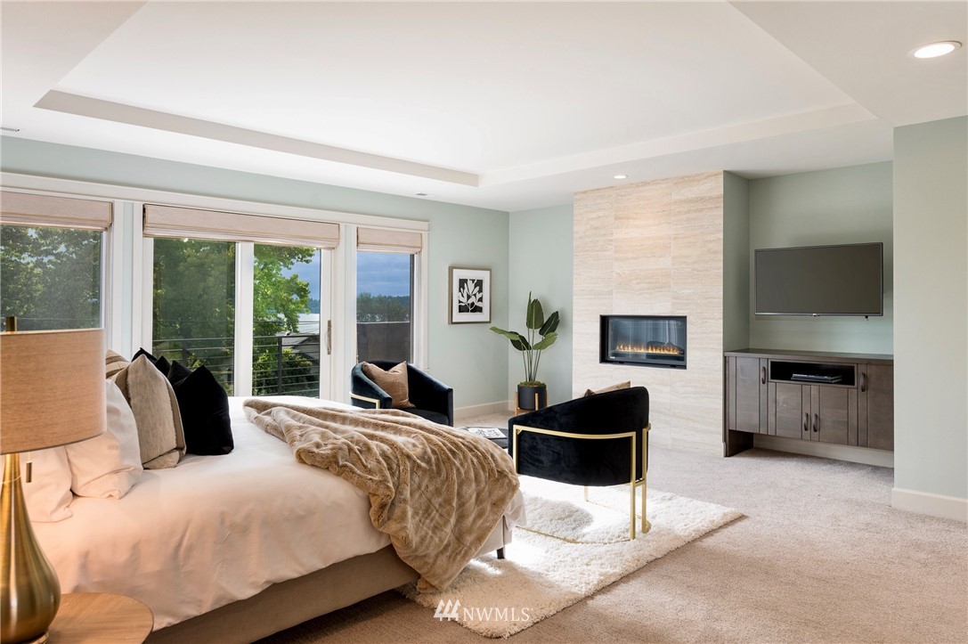 212 5th Avenue West Kirkland, WA 98033 - Photo 23 of 36 a bedroom with a bed couches chair and a large window