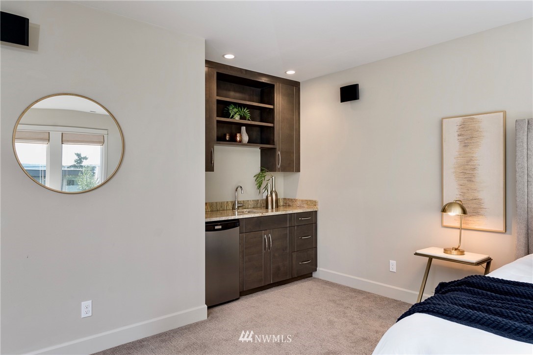 212 5th Avenue West Kirkland, WA 98033 - Photo 31 of 36 a spacious bathroom with a sink a mirror and a toilet