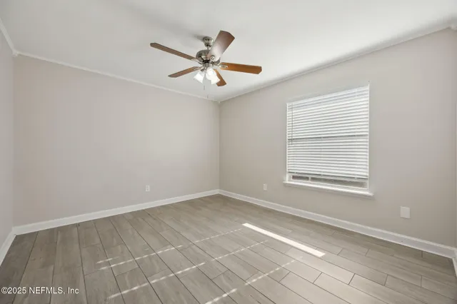 a view of an empty room with a window