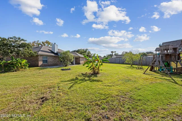 a view of a lake with a big yard