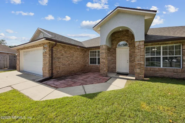 a front view of a house with yard