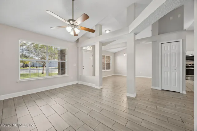 a view of an empty room with a window