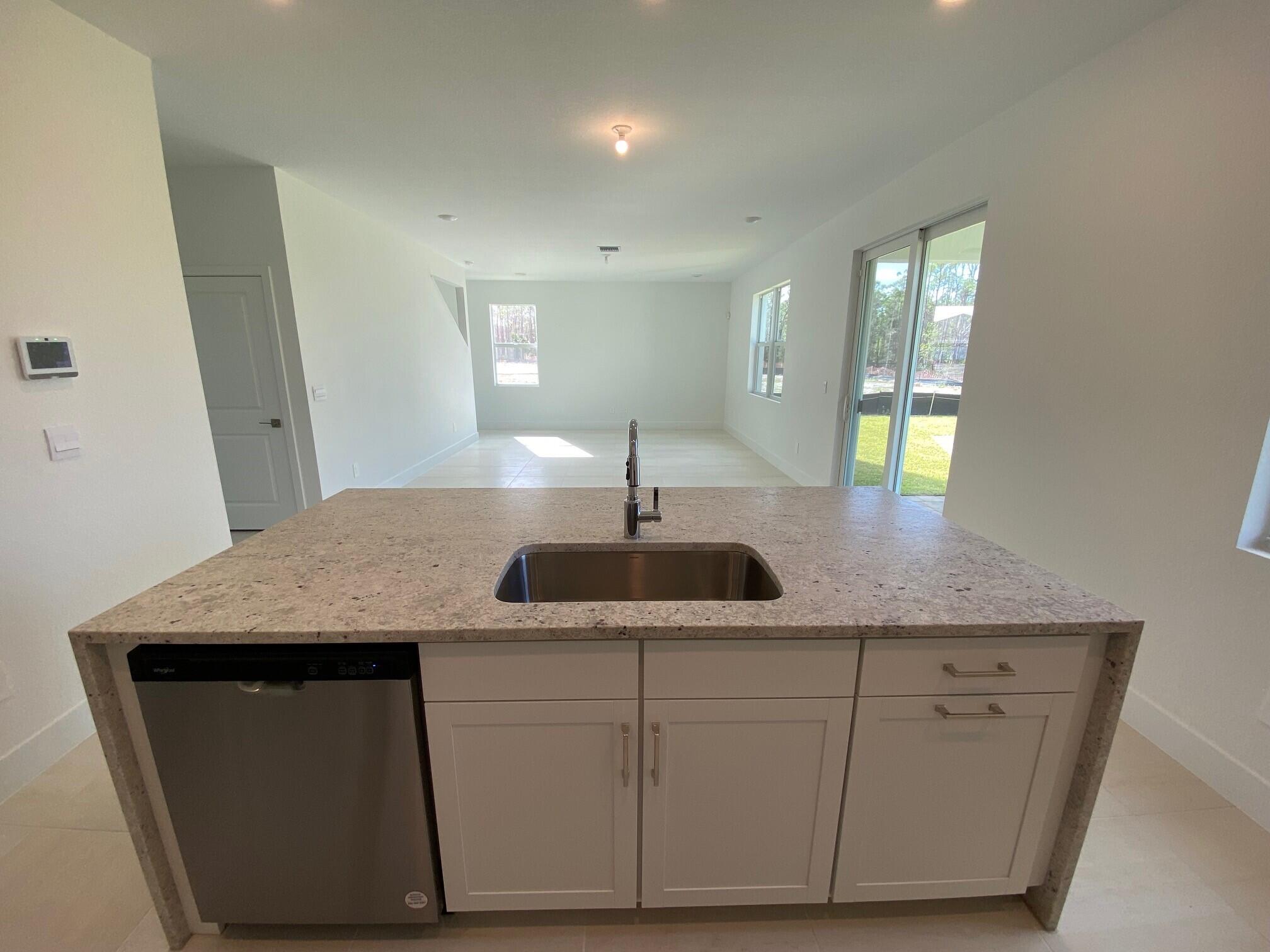 6800 Southeast Park Trace Drive Stuart, FL 34997 - Photo 8 of 12 PPT 38 Kitchen island