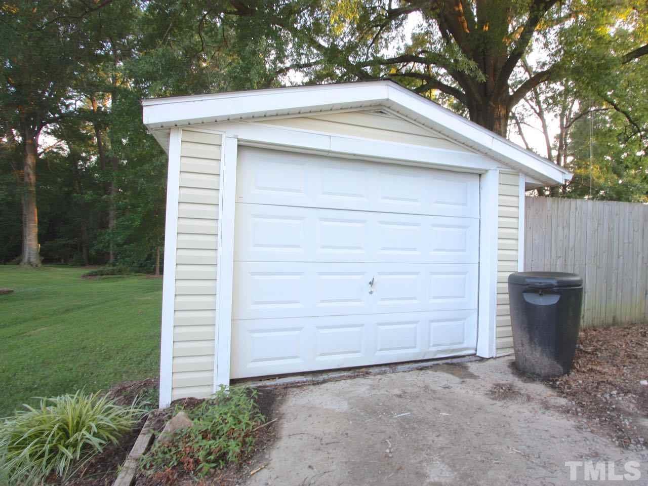 1310 Carpenter Fletcher Road Durham, NC 27713 - Photo 22 of 23 The roof on the house was installed in 2016. The roof on the garage is much older.