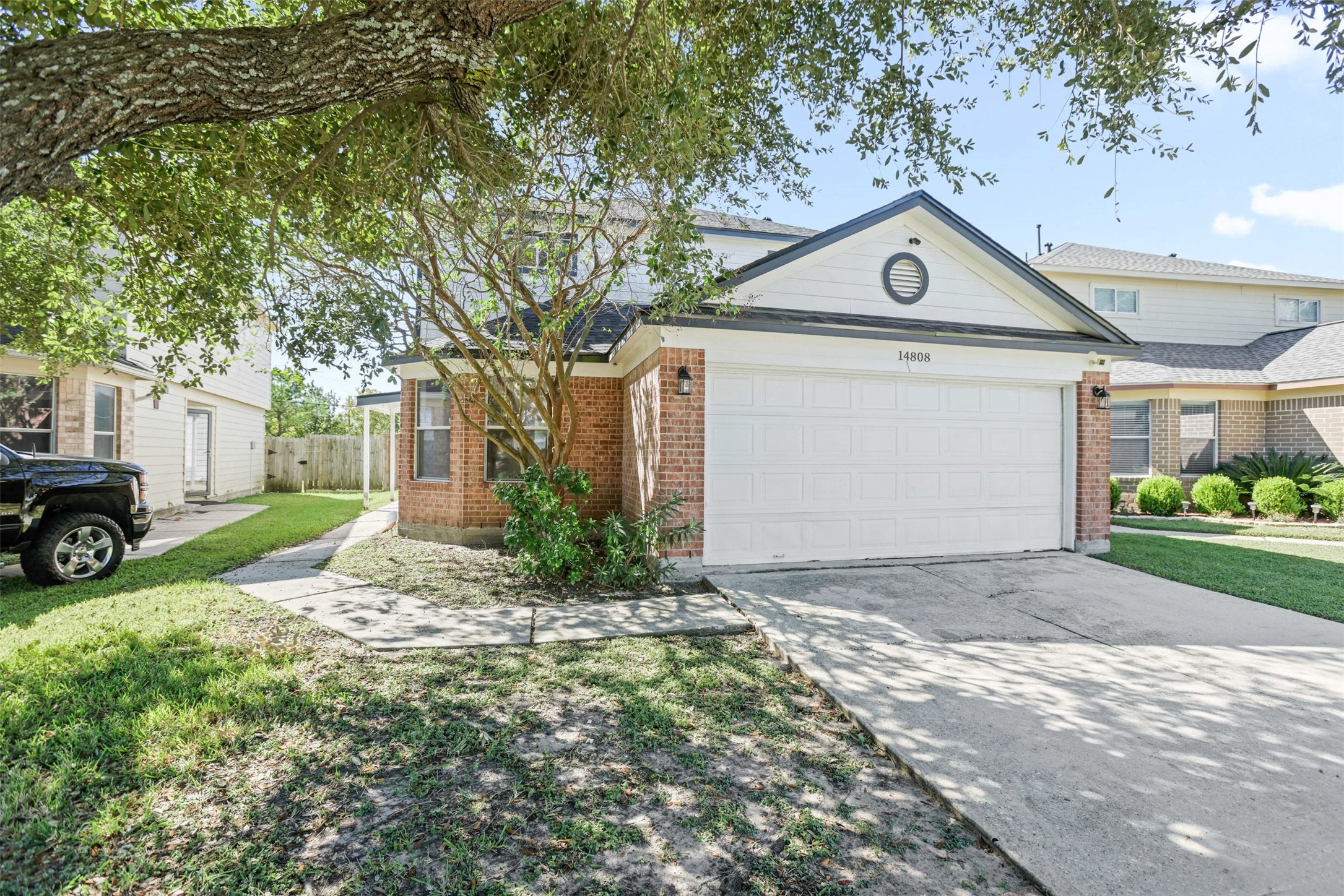 14808 Welbeck Drive Channelview, TX 77530 - Photo 1 of 36 a view of a house with a yard and garage