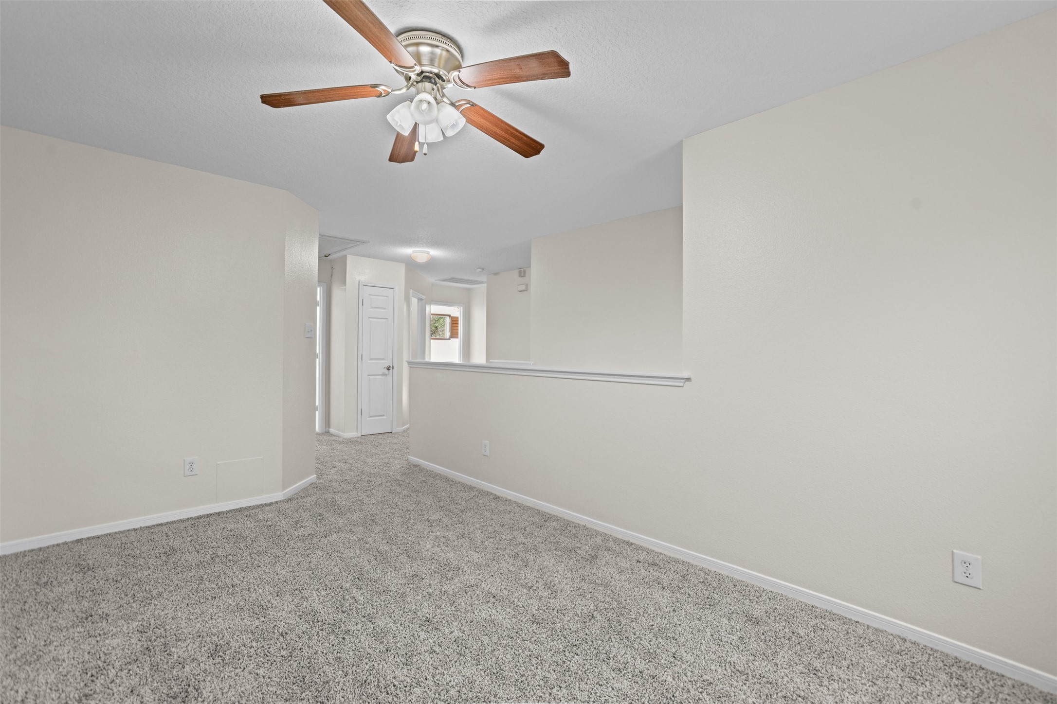 14808 Welbeck Drive Channelview, TX 77530 - Photo 12 of 36 an empty room with fan and windows