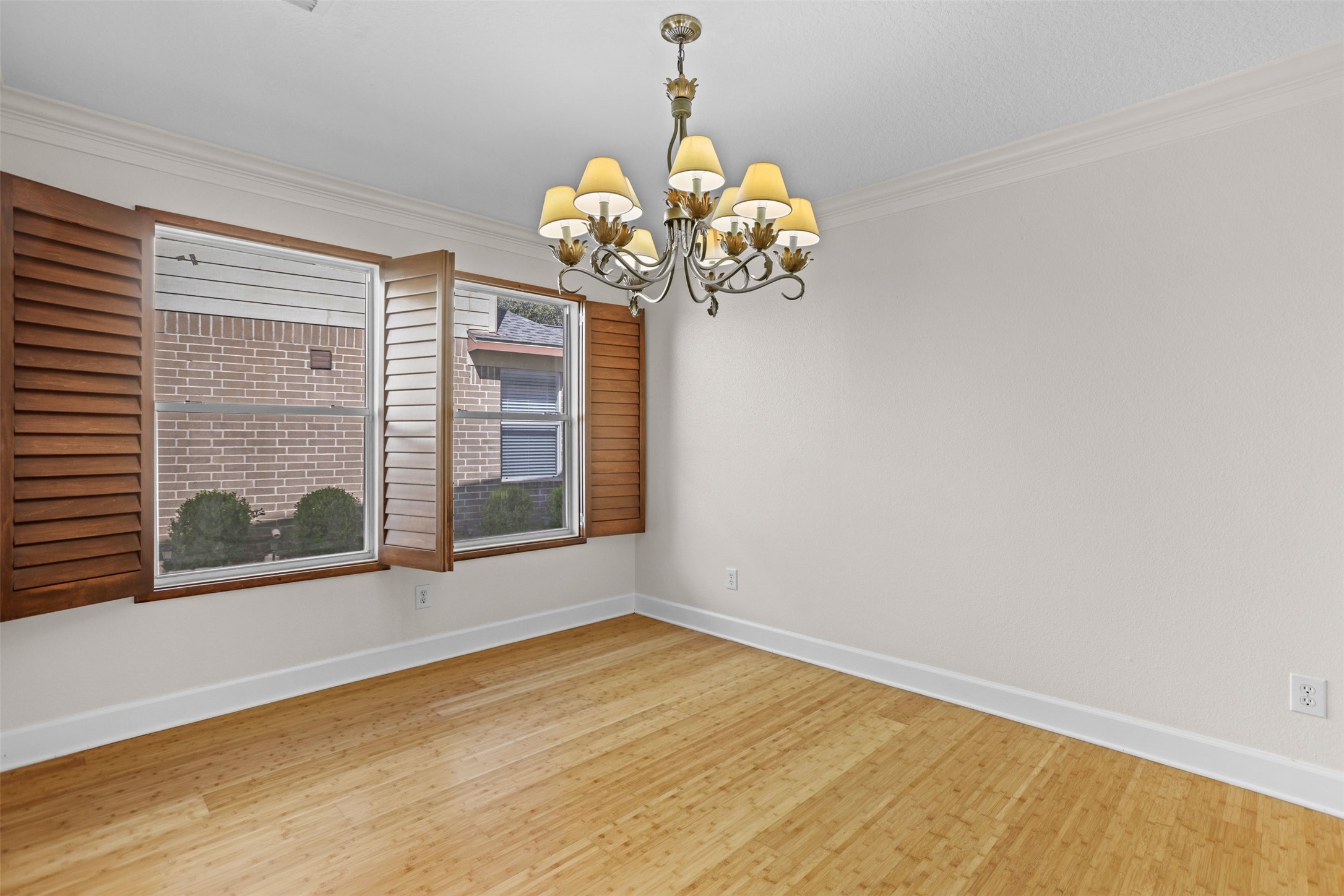 14808 Welbeck Drive Channelview, TX 77530 - Photo 18 of 36 a view of a room with wooden floor and chandelier