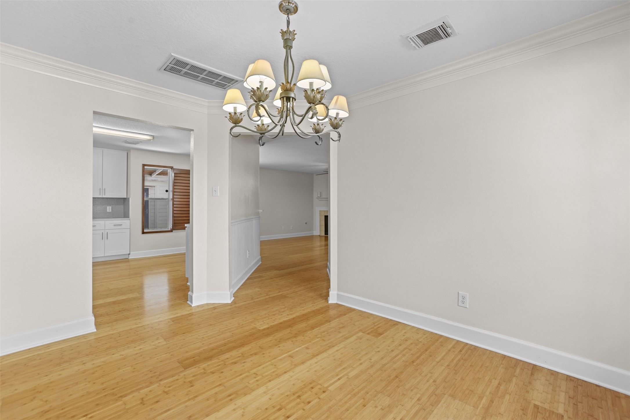 14808 Welbeck Drive Channelview, TX 77530 - Photo 20 of 36 a view of a room with wooden floor and chandelier