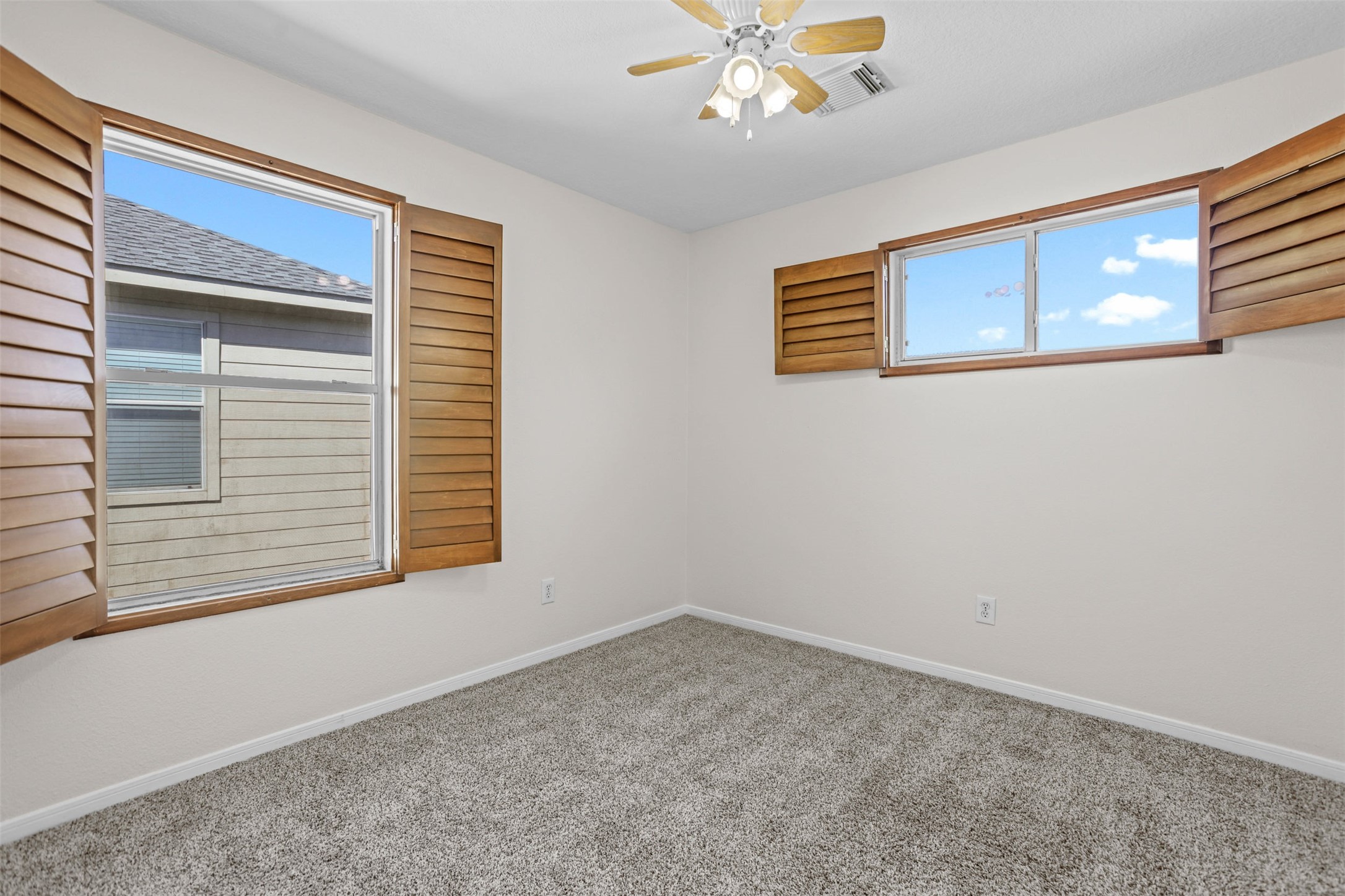 14808 Welbeck Drive Channelview, TX 77530 - Photo 22 of 36 a view of an empty room with a window