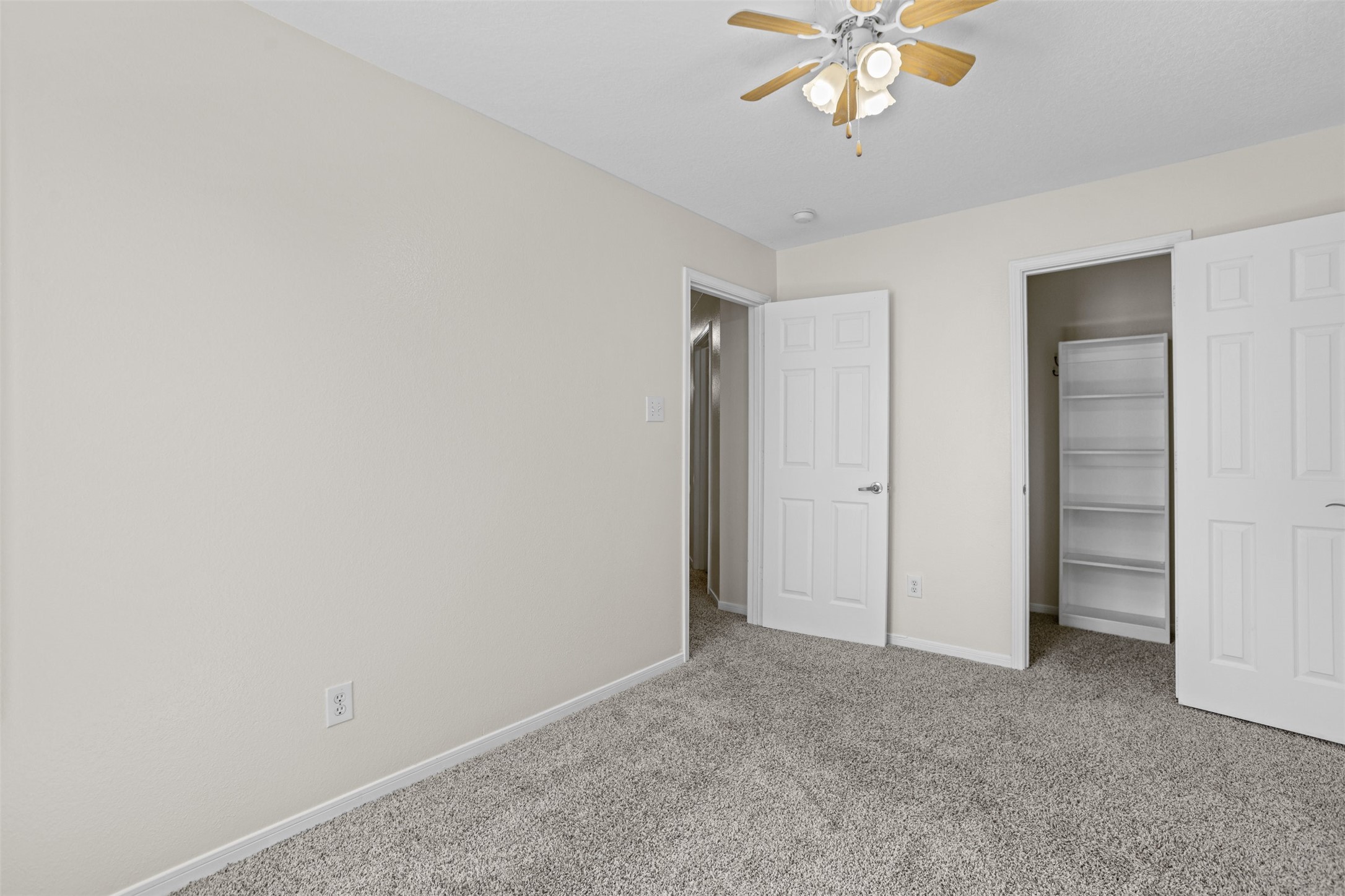 14808 Welbeck Drive Channelview, TX 77530 - Photo 26 of 36 a view of an empty room with a ceiling fan