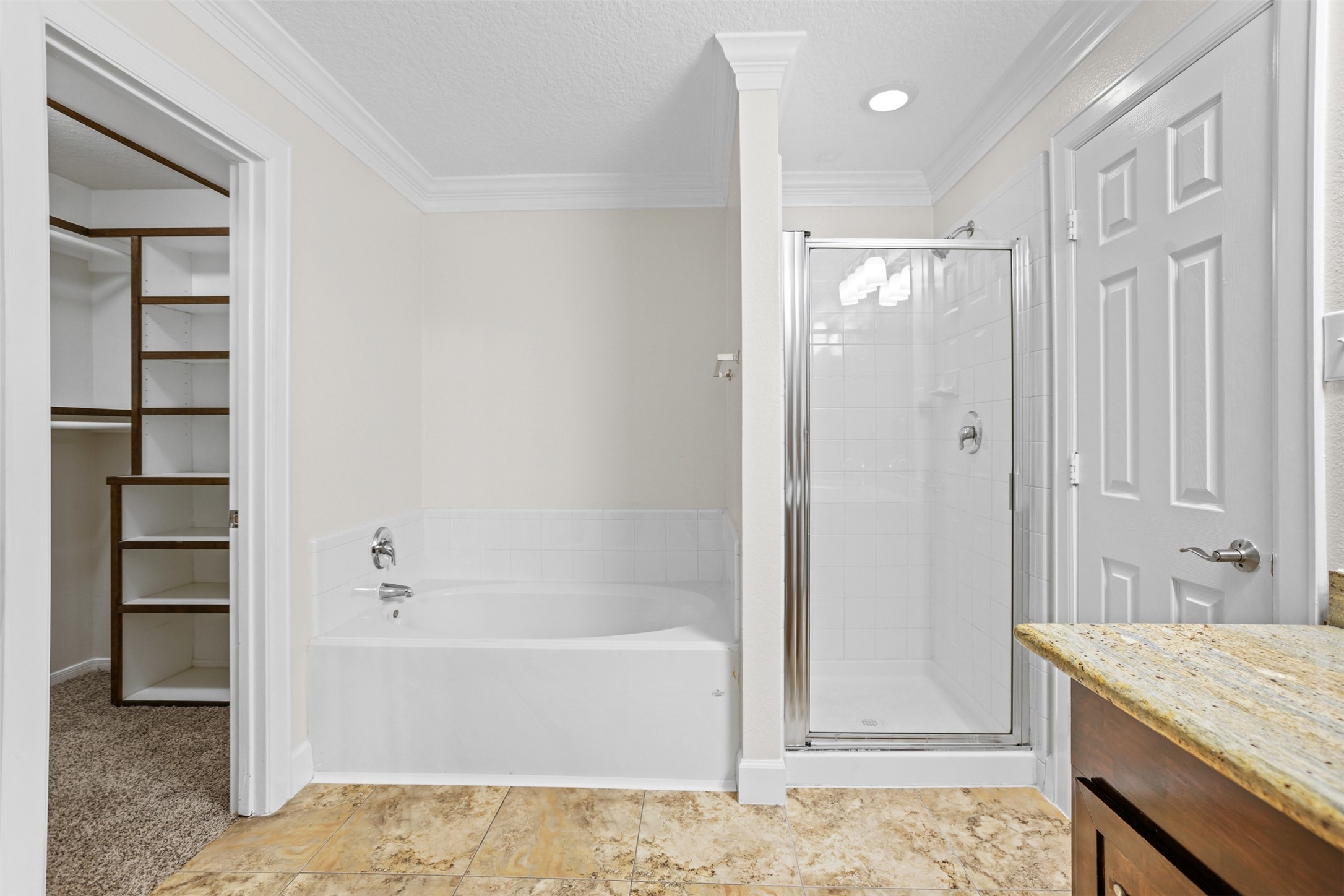 14808 Welbeck Drive Channelview, TX 77530 - Photo 29 of 36 a bathroom with a tub shower vanity and a sink