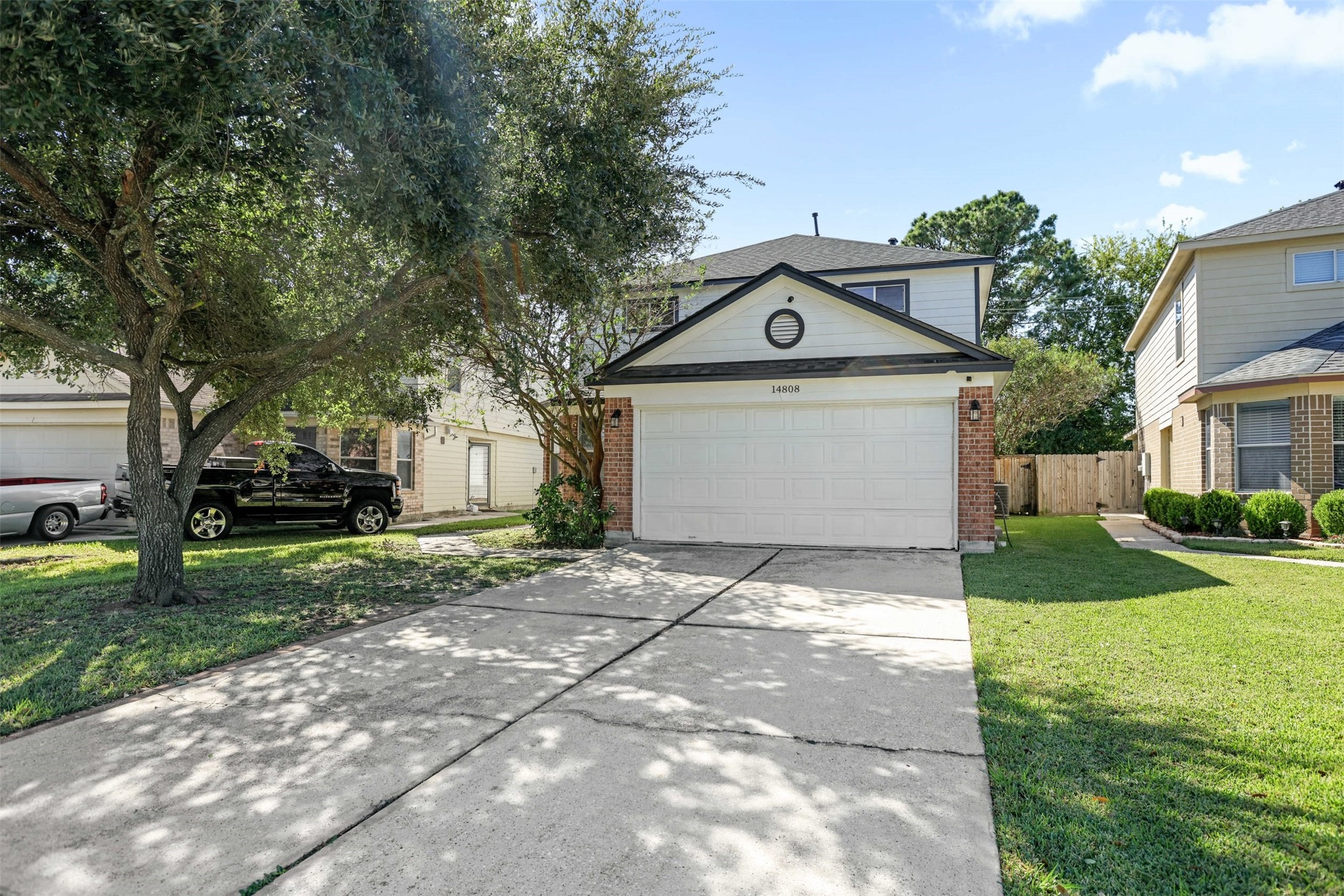 14808 Welbeck Drive Channelview, TX 77530 - Photo 4 of 36 a front view of a house with a yard and garage