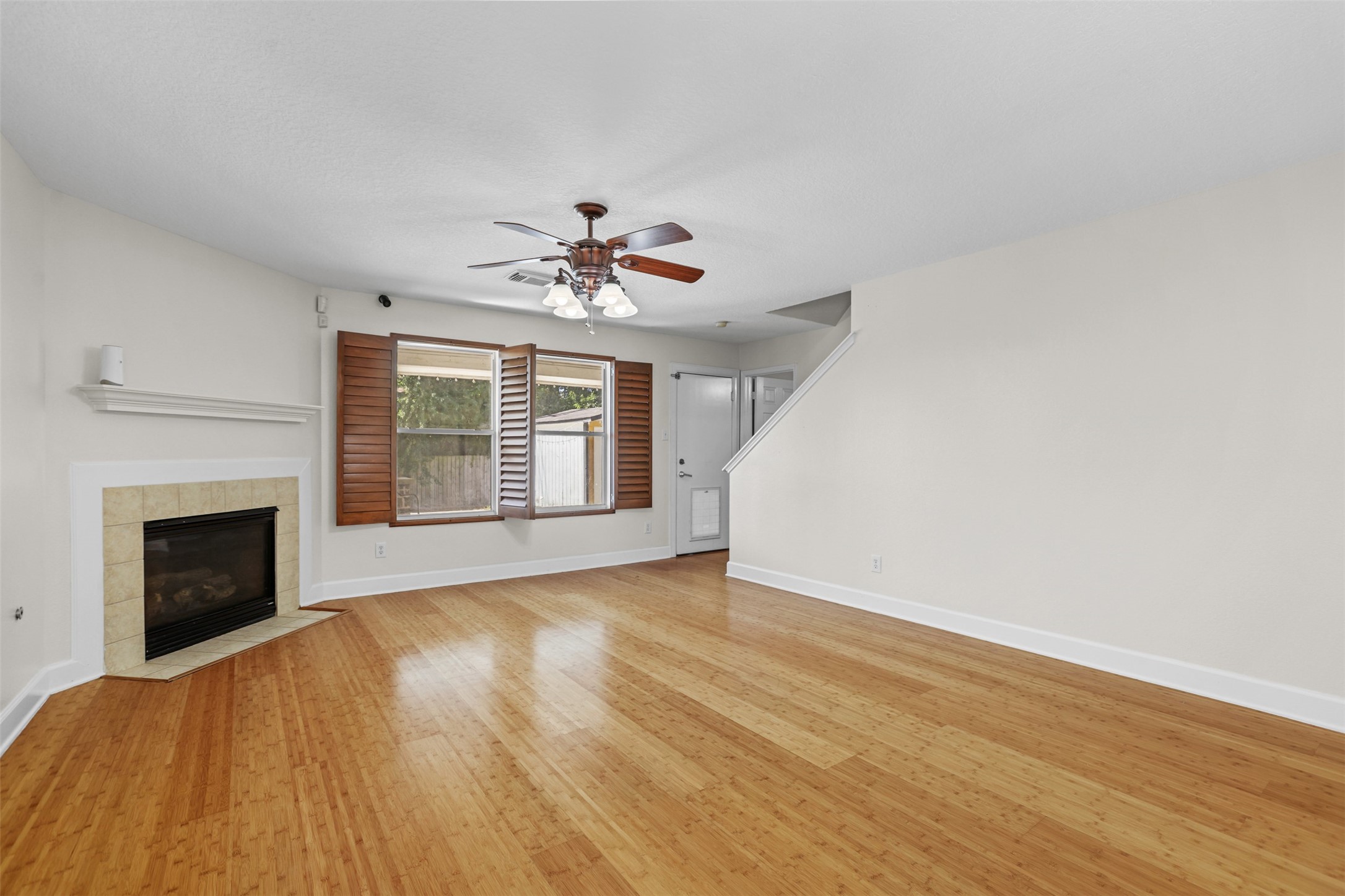 14808 Welbeck Drive Channelview, TX 77530 - Photo 5 of 36 a view of an empty room with chandelier and fireplace
