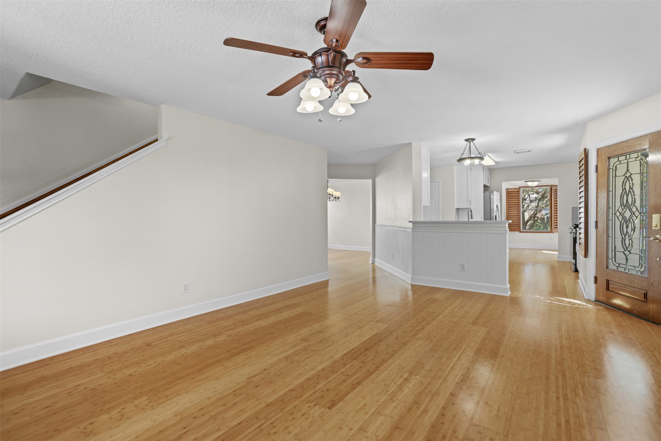 14808 Welbeck Drive Channelview, TX 77530 - Photo 7 of 36 a view of an empty room with a window and wooden floor