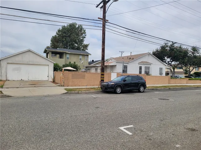 a view of a car parked in front of a house