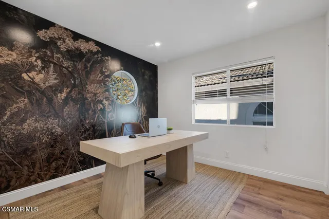 a view of a hallway with seating area