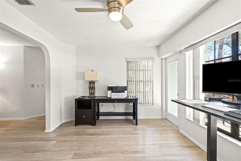 6665 Water Oak Court Spring Hill, FL 34606 - Photo 11 of 64 a view of a livingroom with a flat screen tv