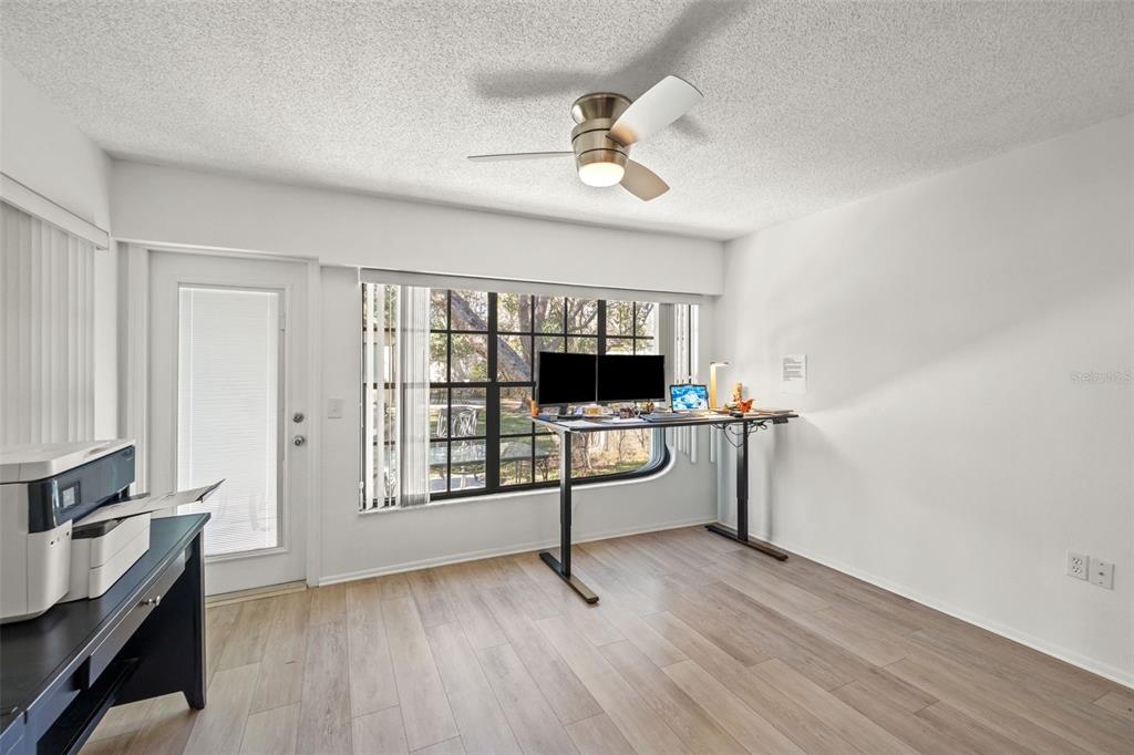 6665 Water Oak Court Spring Hill, FL 34606 - Photo 12 of 64 a view of a livingroom with furniture and a window