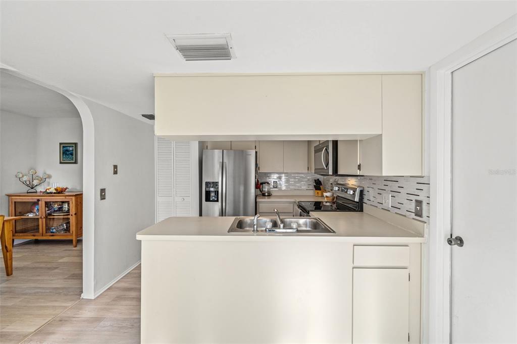 6665 Water Oak Court Spring Hill, FL 34606 - Photo 13 of 64 a view of living room with furniture and a flat screen tv