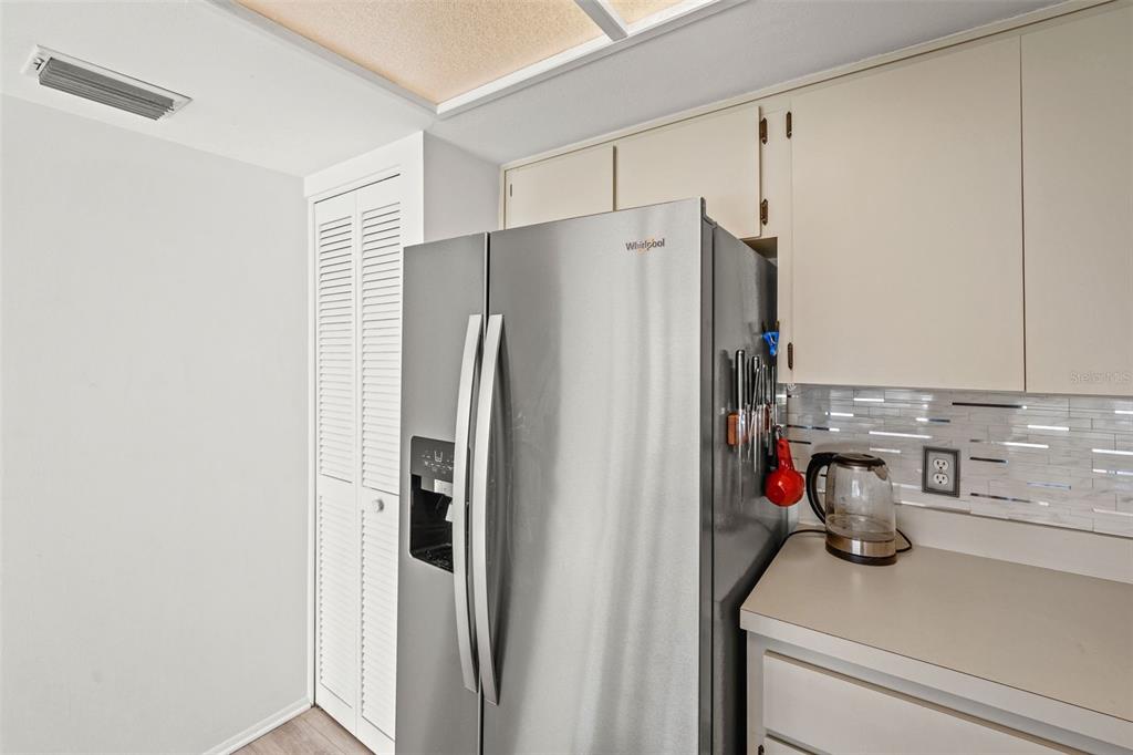 6665 Water Oak Court Spring Hill, FL 34606 - Photo 14 of 64 a bathroom with a refrigerator and a sink
