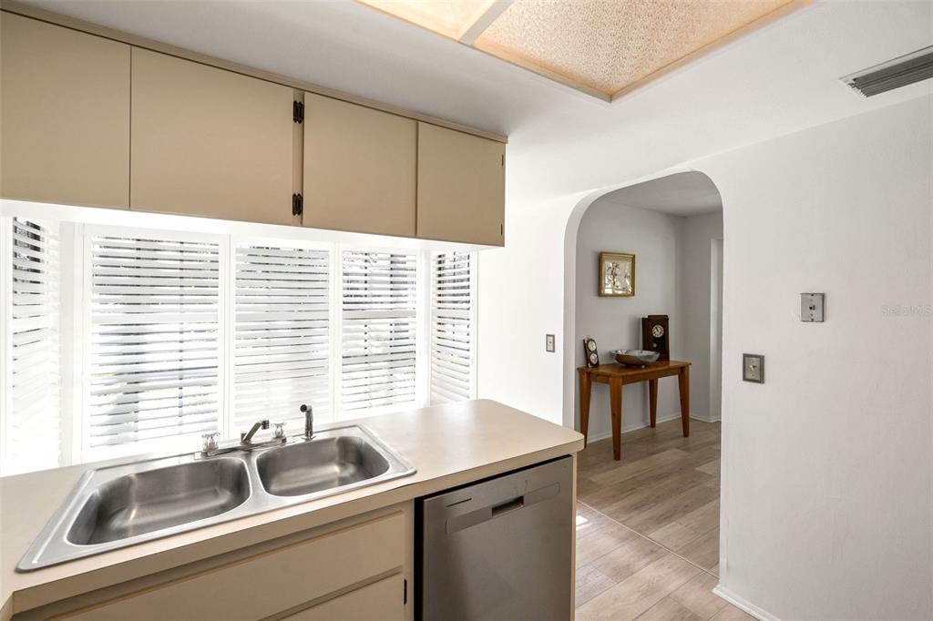 6665 Water Oak Court Spring Hill, FL 34606 - Photo 16 of 64 a kitchen with a sink and a window