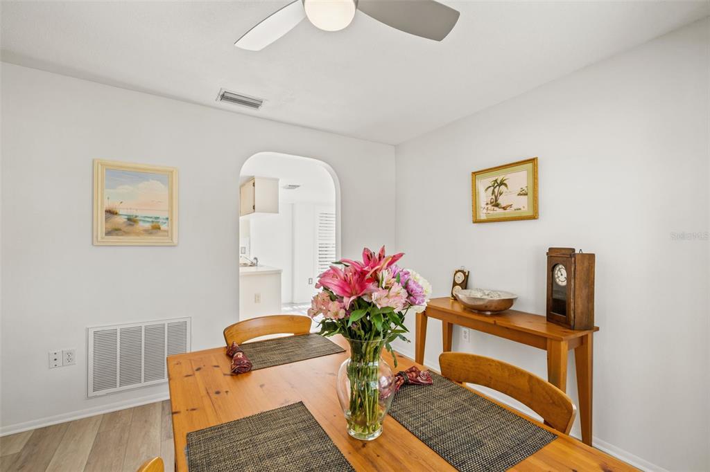 6665 Water Oak Court Spring Hill, FL 34606 - Photo 21 of 64 a living room with furniture and flowers