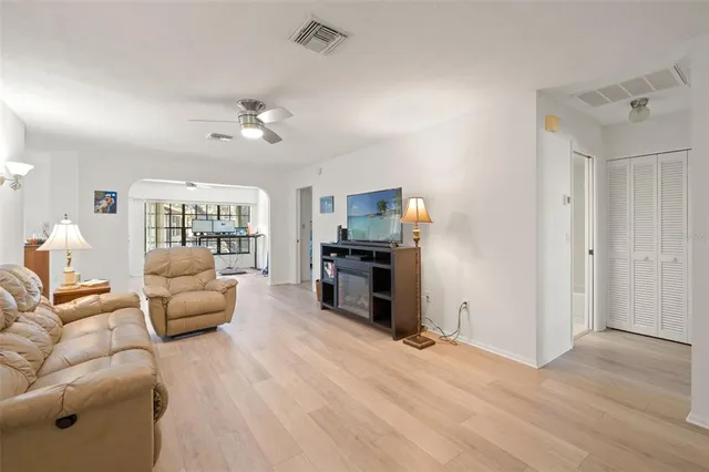 a bathroom with a shower sink vanity and mirror