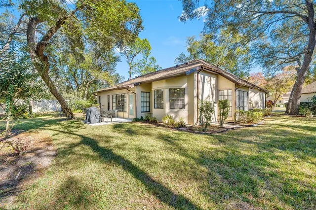 a view of a swimming pool with a house in the background