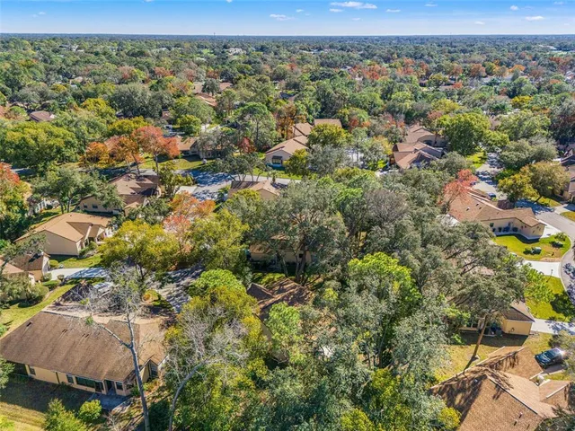 an aerial view of a residential houses with outdoor space